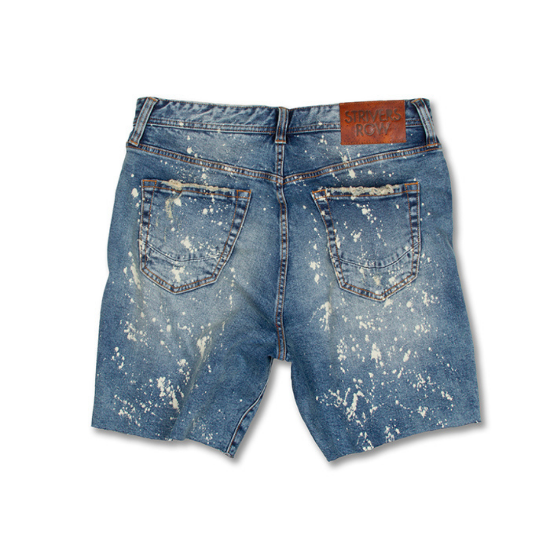 An Alpine Jean Short with paint splatters on it.