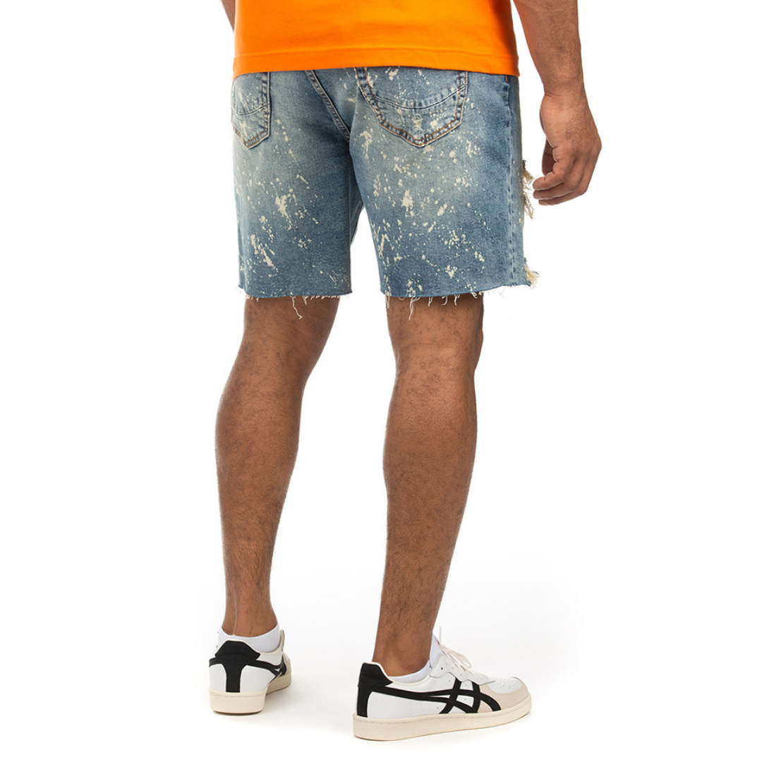 The back view of a man wearing an orange t-shirt and Alpine Jean Shorts.